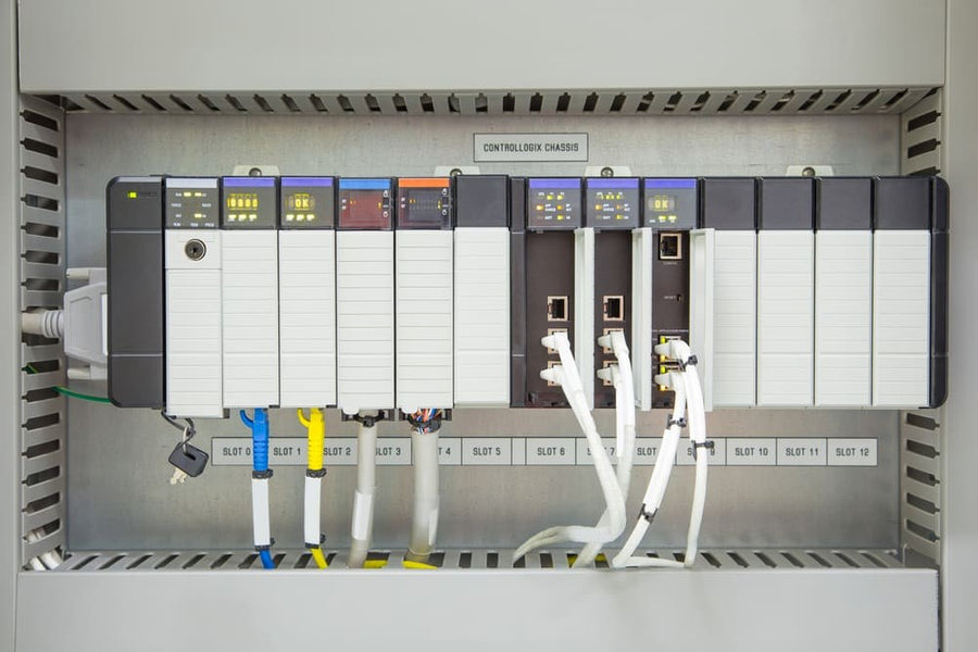 Modular PLC chassis with processor, power supply, and analog-digital I/O cards
