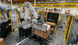 Integrated robotic palletizing cell with infeed conveyors and two pallet stations